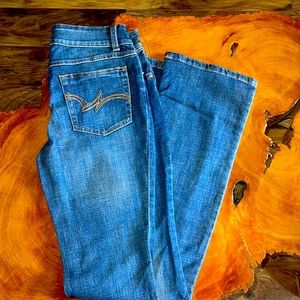 These jeans have never been worn, dark wash bootcut.